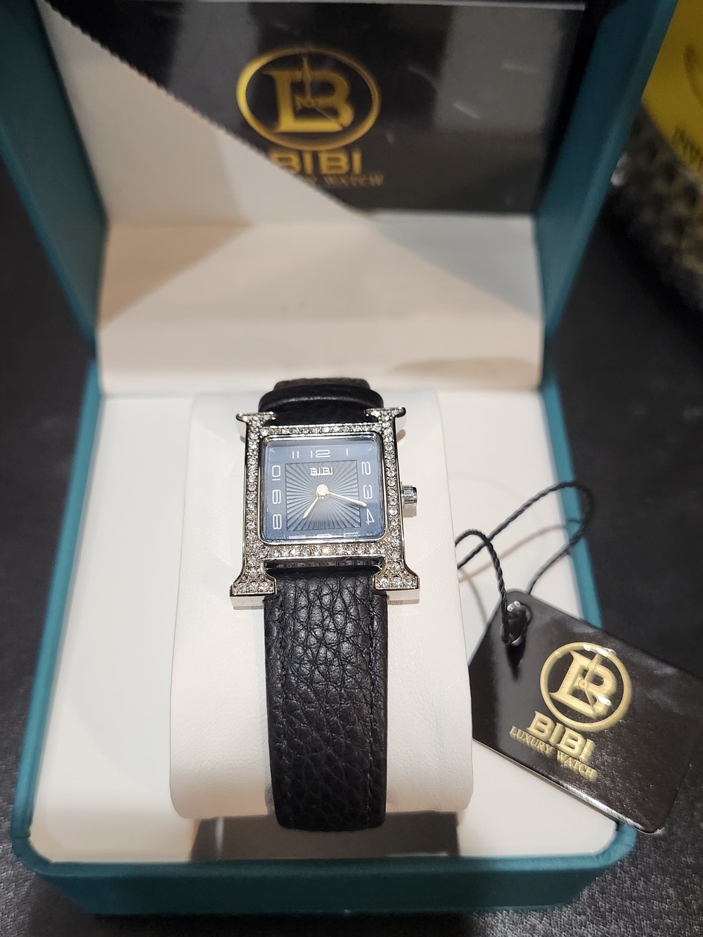 Bibi crystal-trimmed "H"-case watch featuring a textured blue sunburst